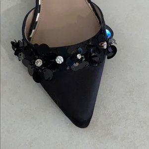 Black shoes with black sparkles and a little heel